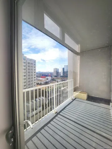 a view of a balcony with wooden floor