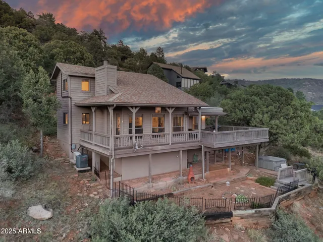 an aerial view of a house with a yard balcony