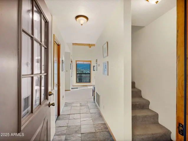 a kitchen with a refrigerator and countertop