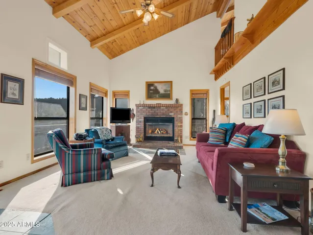 a bathroom with a granite countertop sink toilet a mirror and shower