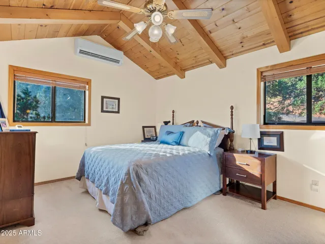 a bathroom with a granite countertop sink toilet a mirror and shower