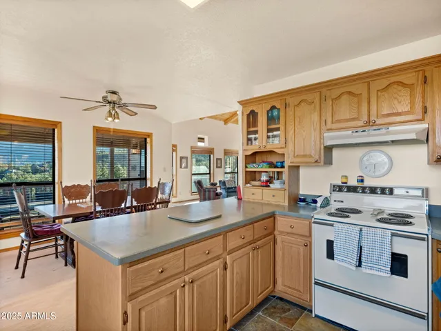 a kitchen with a refrigerator and a sink