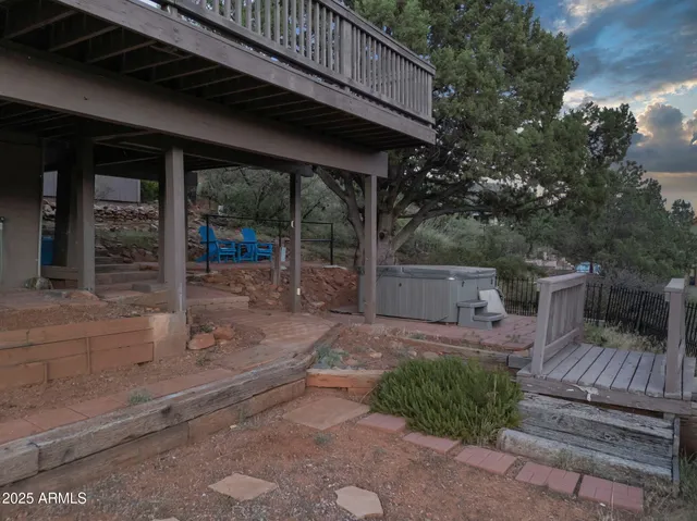 a view of a house with a roof deck and a garden