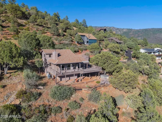 an aerial view of a house with mountain view