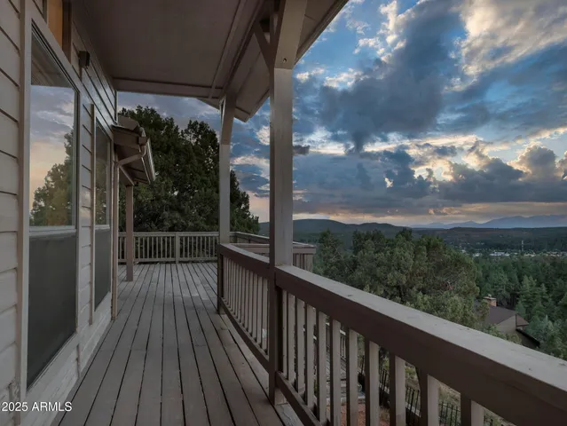 a view of a balcony with wooden floor
