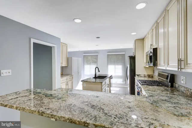 a view of a living room and a sink