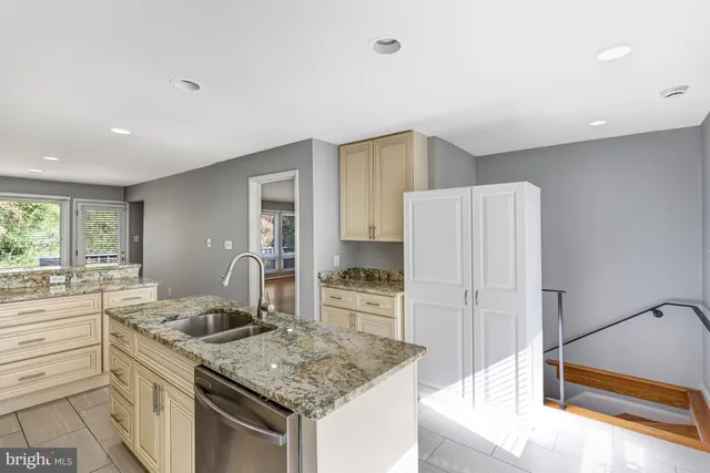 a kitchen with a sink stove and refrigerator
