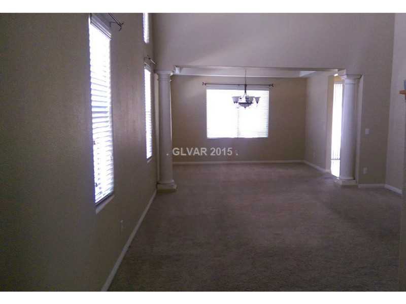 9064 Rusty Rifle Avenue Las Vegas, NV 89143 - Photo 23 of 24 Living Room. Large front living room and dinning room
