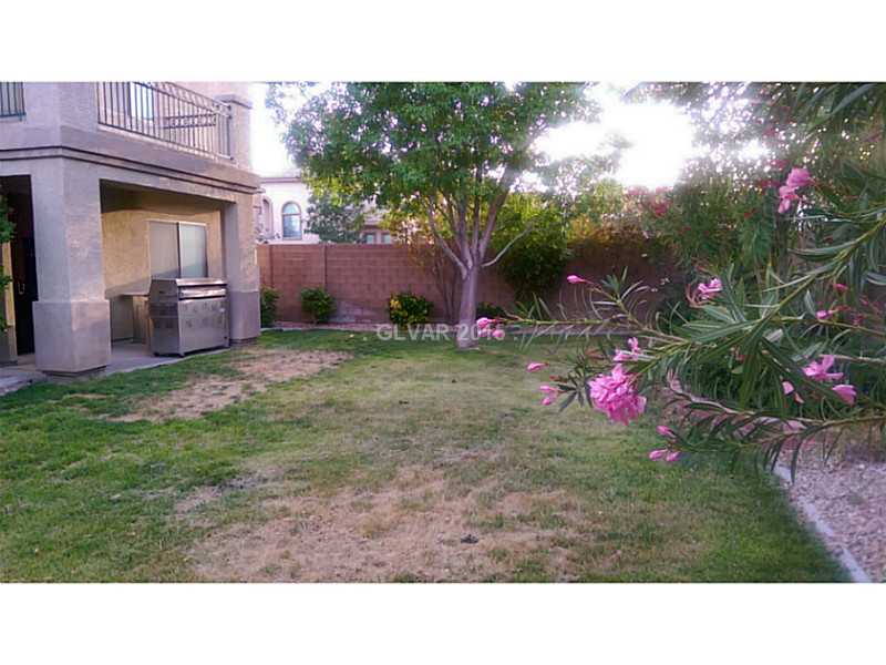 9064 Rusty Rifle Avenue Las Vegas, NV 89143 - Photo 10 of 24 Yard/Garden. backyard and patio