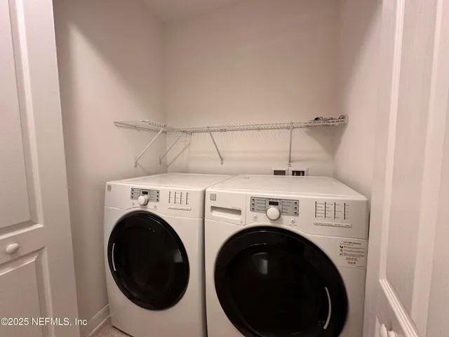 a view of a big room with windows