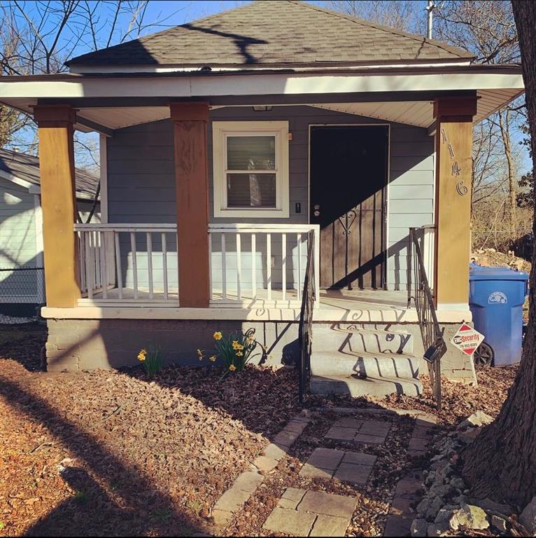 1146 Sims Street Southwest Atlanta, GA 30310 - Photo 1 of 1 a front view of a house with a large window