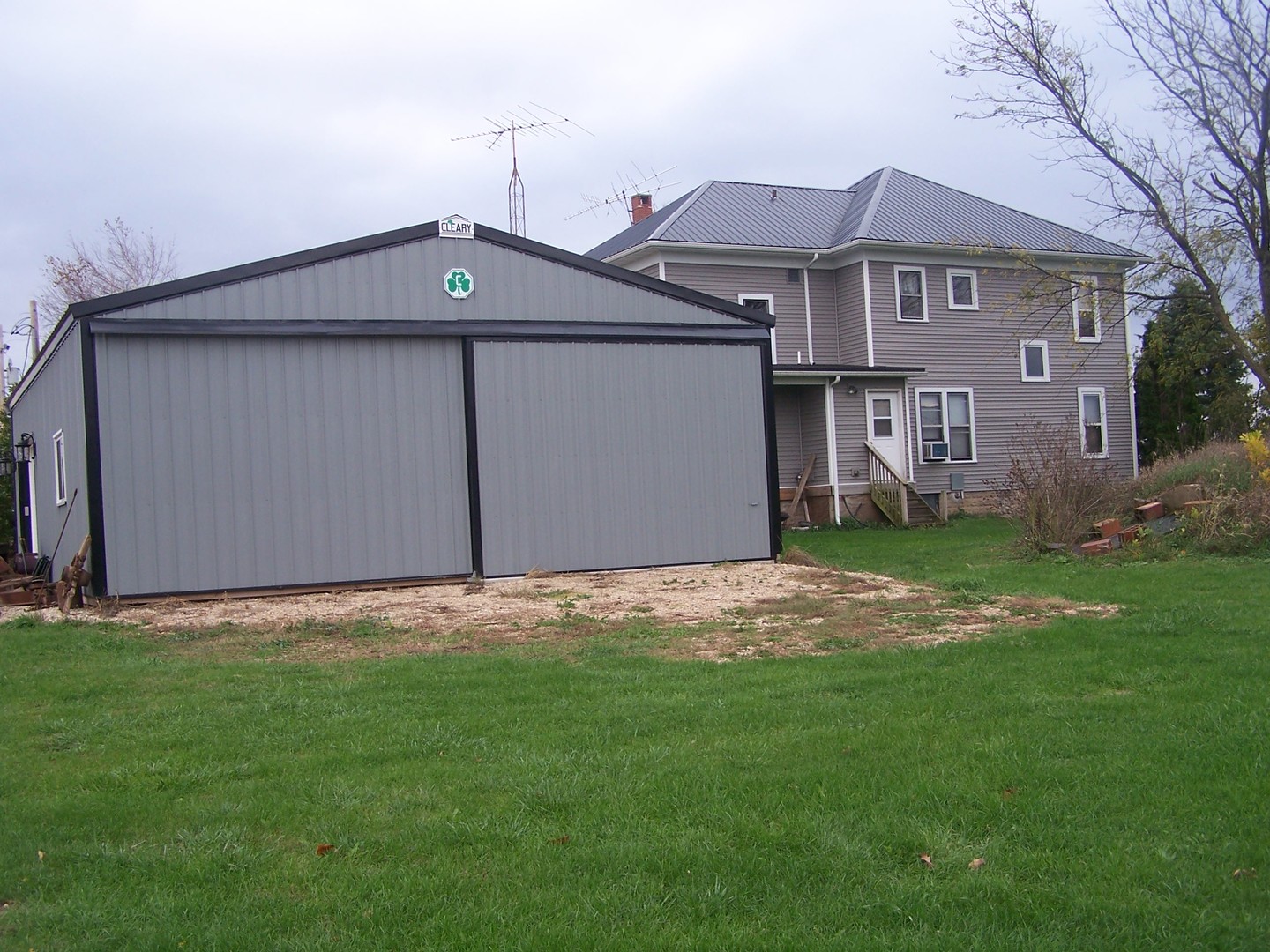 4045 East 22nd Road Serena, IL 60549 - Photo 30 of 31 a front view of a house with a yard and garage