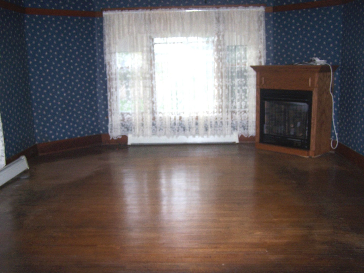 4045 East 22nd Road Serena, IL 60549 - Photo 8 of 31 a view of empty room with wooden floor and fan