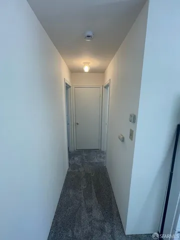 a kitchen with a refrigerator and a sink