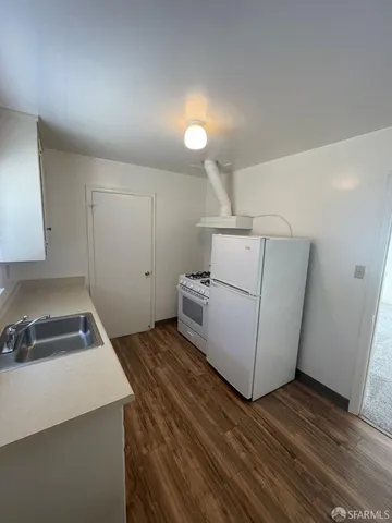a bath room with a sink and a mirror