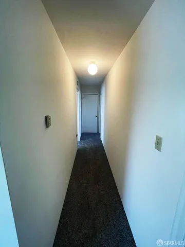 a kitchen with stainless steel appliances granite countertop a refrigerator a sink a stove and white cabinets