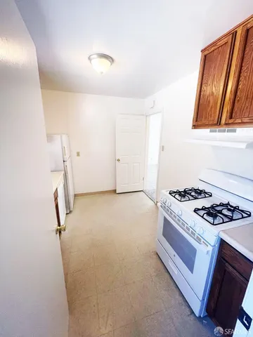 a view of a room with rack on the wall and wooden floor