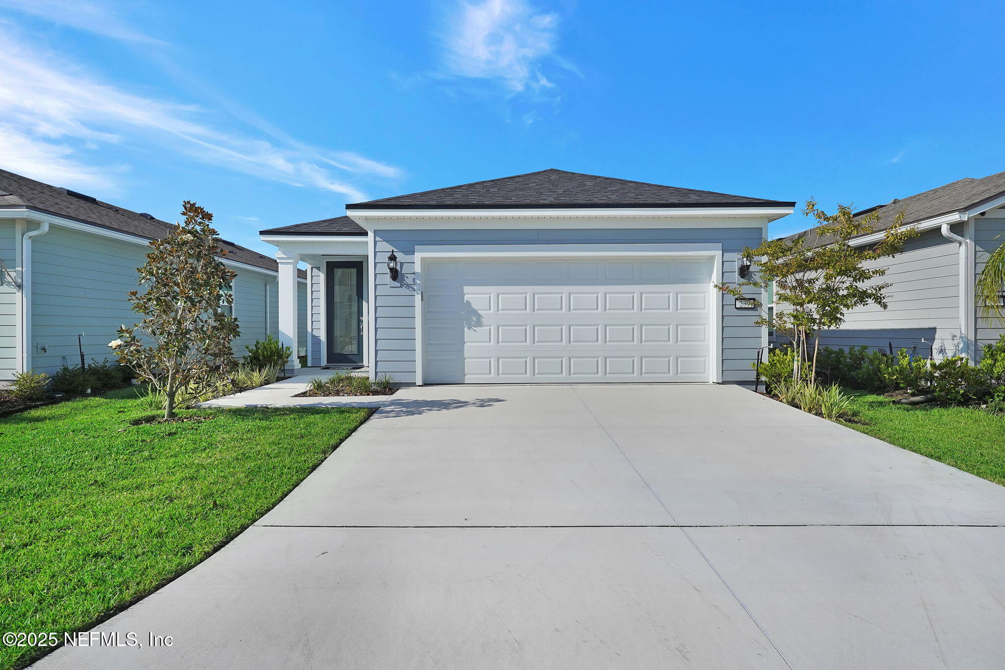 239 Fairlake Circle St. Augustine, FL 32092 - Photo 2 of 30 a front view of a house with a yard and garage