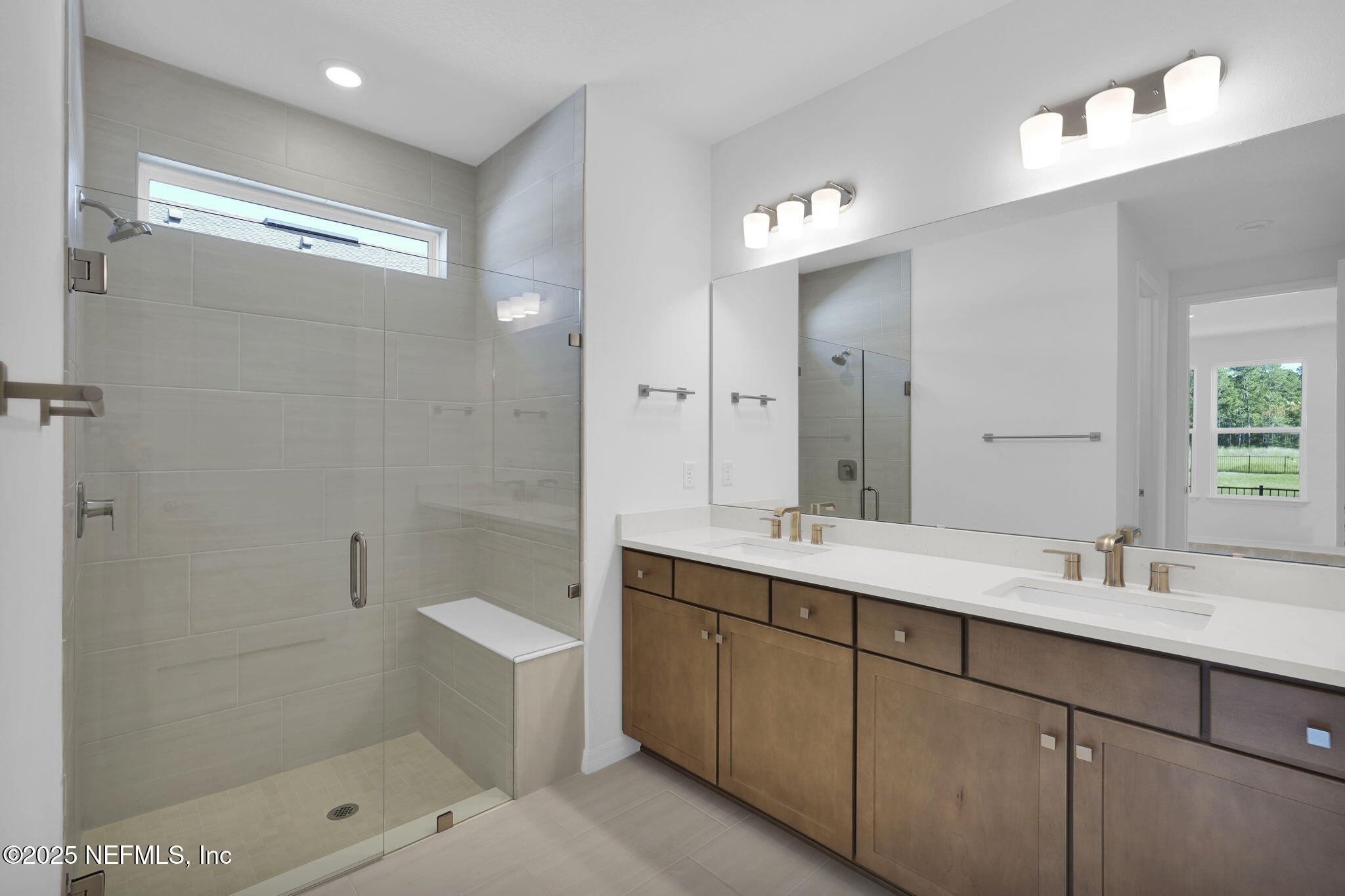 239 Fairlake Circle St. Augustine, FL 32092 - Photo 24 of 30 a bathroom with a double vanity sink mirror and shower