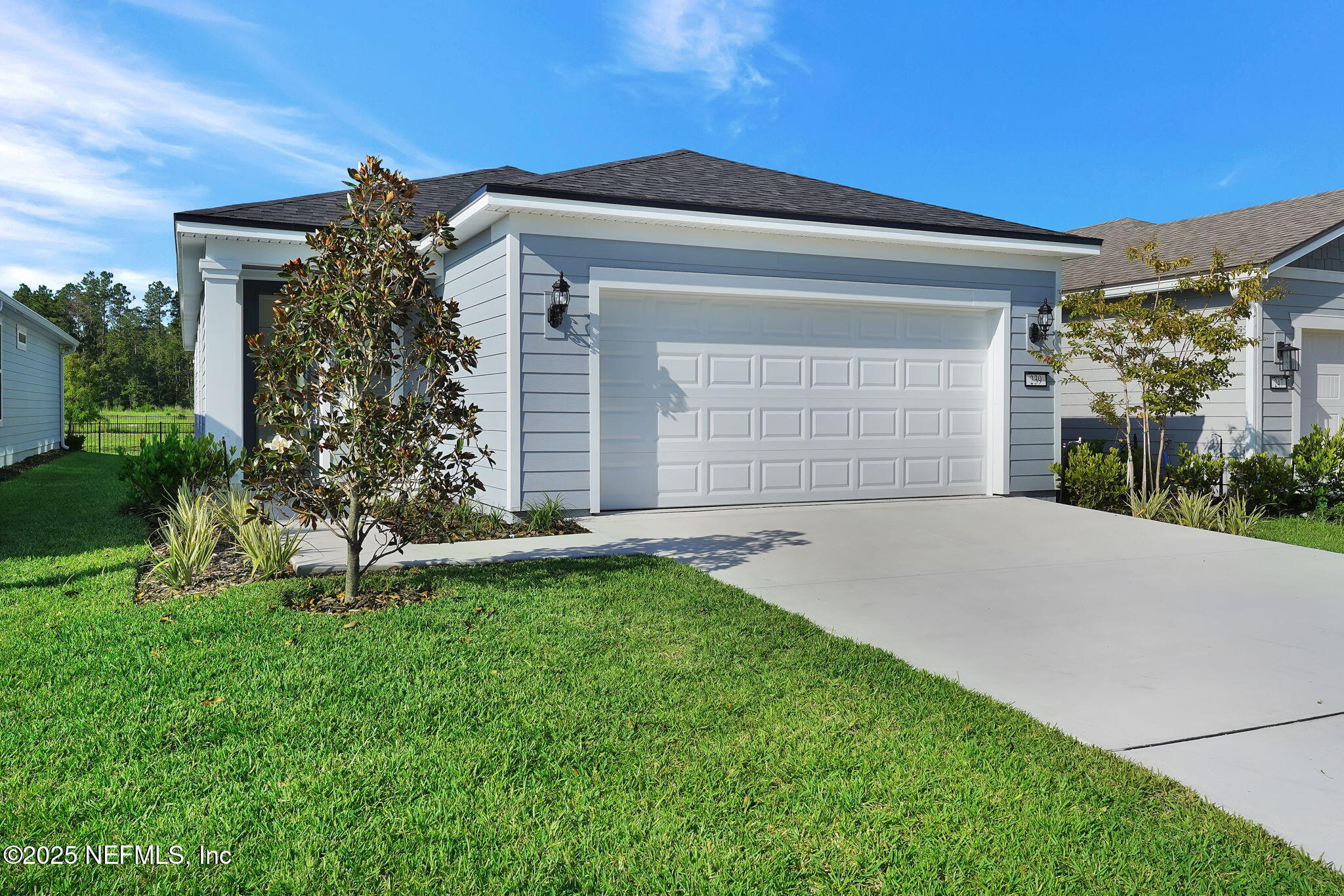 239 Fairlake Circle St. Augustine, FL 32092 - Photo 3 of 30 a front view of a house with garden