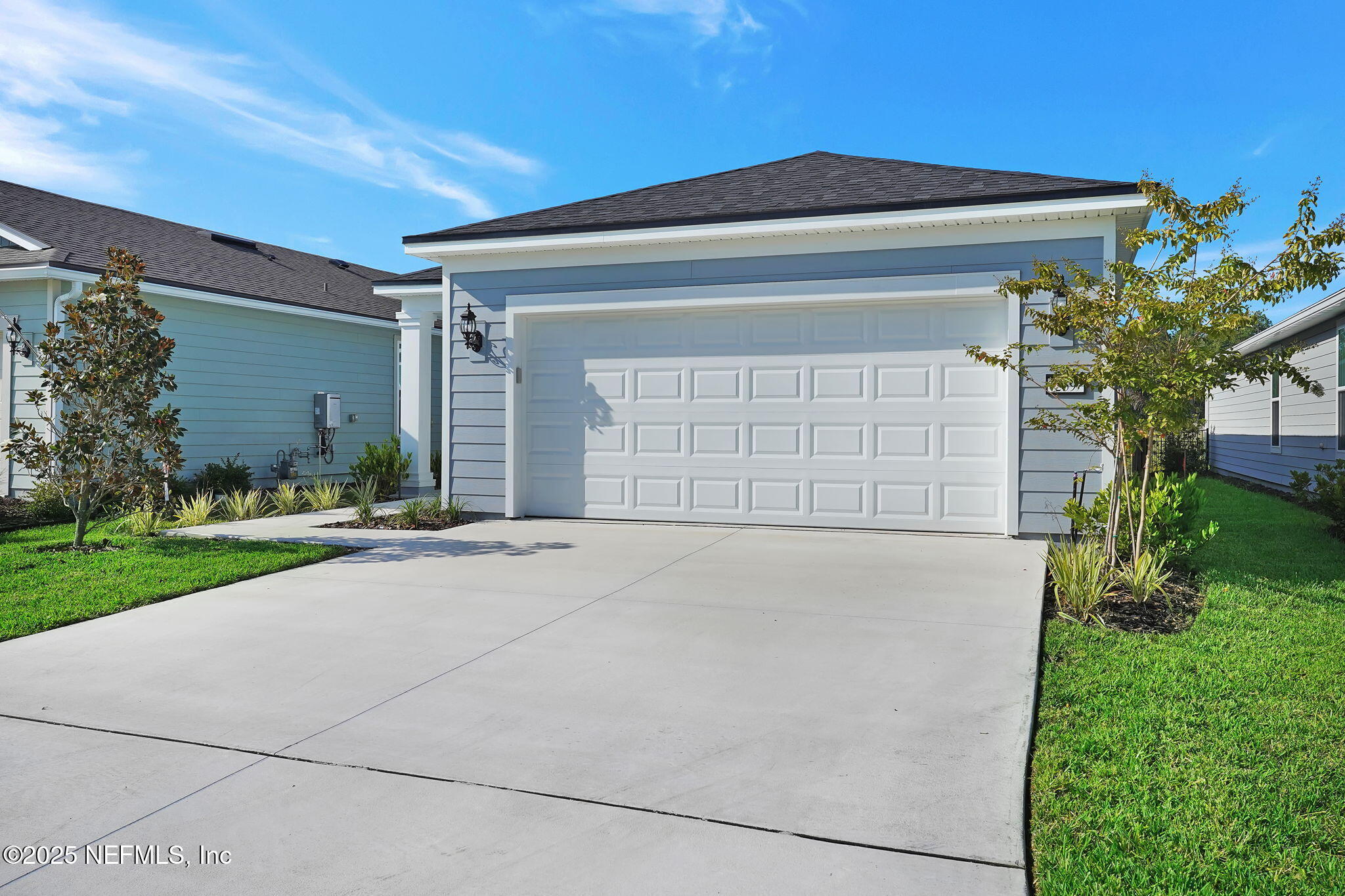 239 Fairlake Circle St. Augustine, FL 32092 - Photo 4 of 30 a front view of a house with a yard and garage
