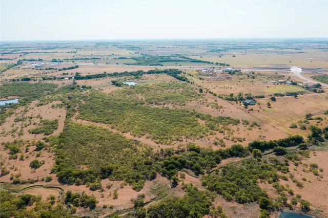 an aerial view of beach and city
