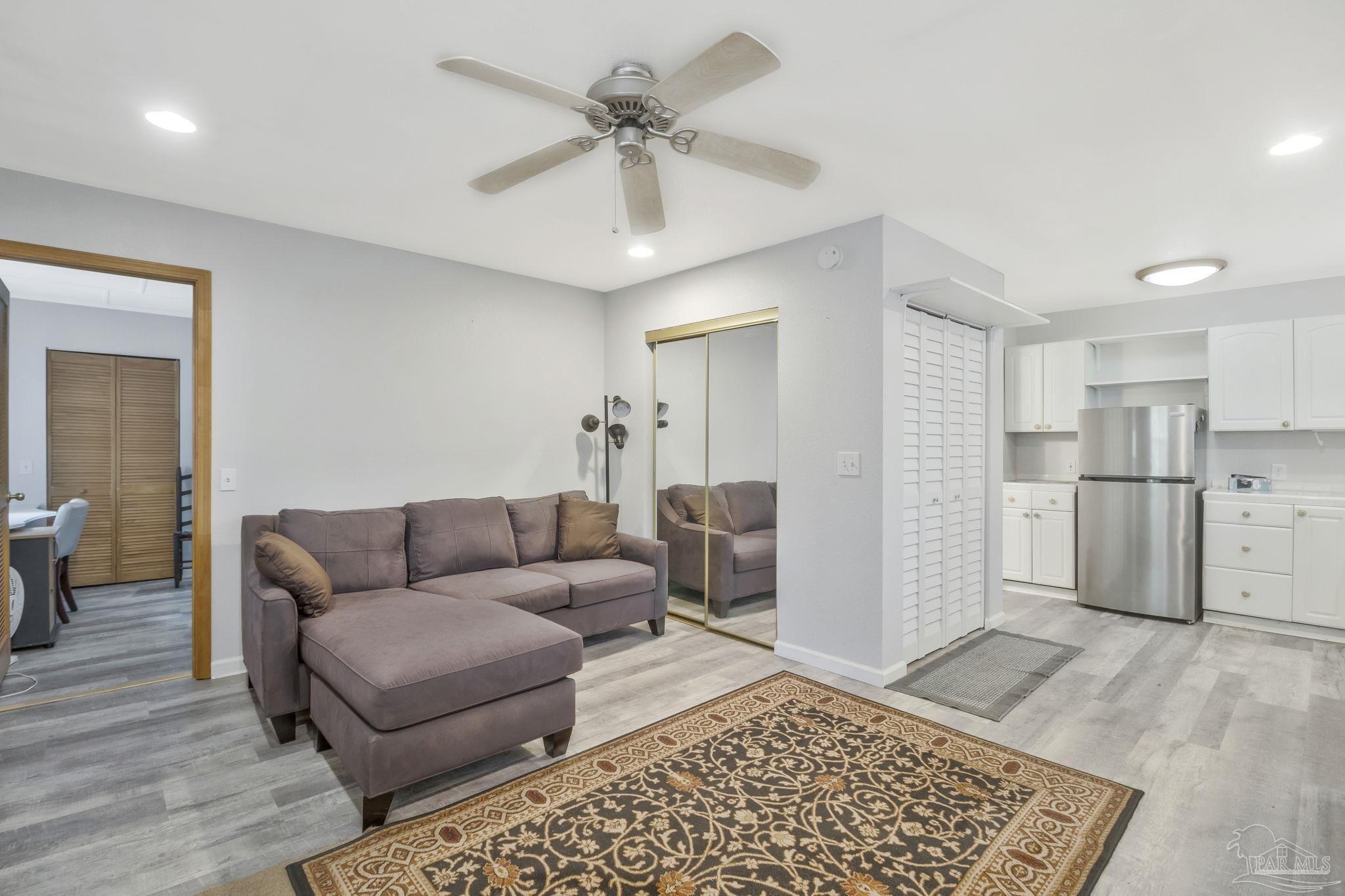 10290 West Lake Road Milton, FL 32583 - Photo 7 of 53 a living room with furniture and a rug