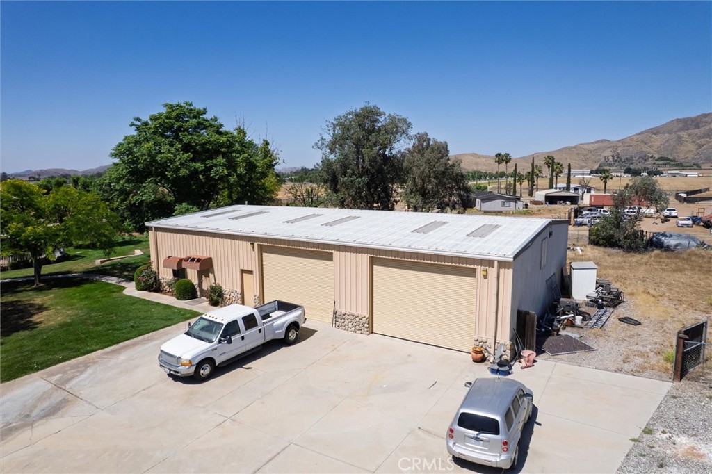 34150 Stowe Road Winchester, CA 92545 - Photo 6 of 80 Separate 3,750 sq ft steel building, 1,075 sq ft ADU. ADU Access is the door on the very left below the awning.