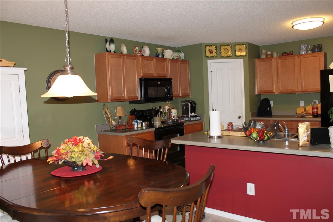 3108 Varcroft Road Knightdale, NC 27545 - Photo 5 of 17 a room with furniture and a flat screen tv