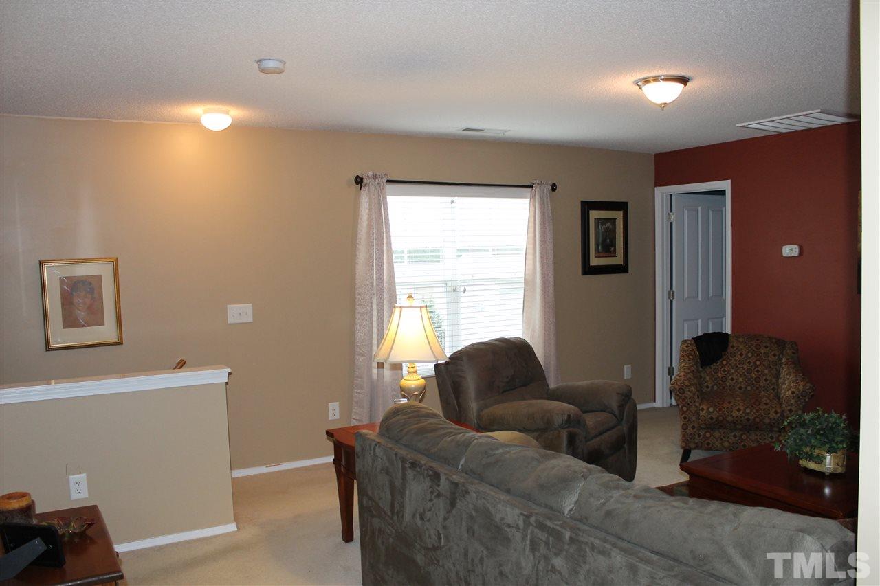 3108 Varcroft Road Knightdale, NC 27545 - Photo 8 of 17 a living room with furniture and a window