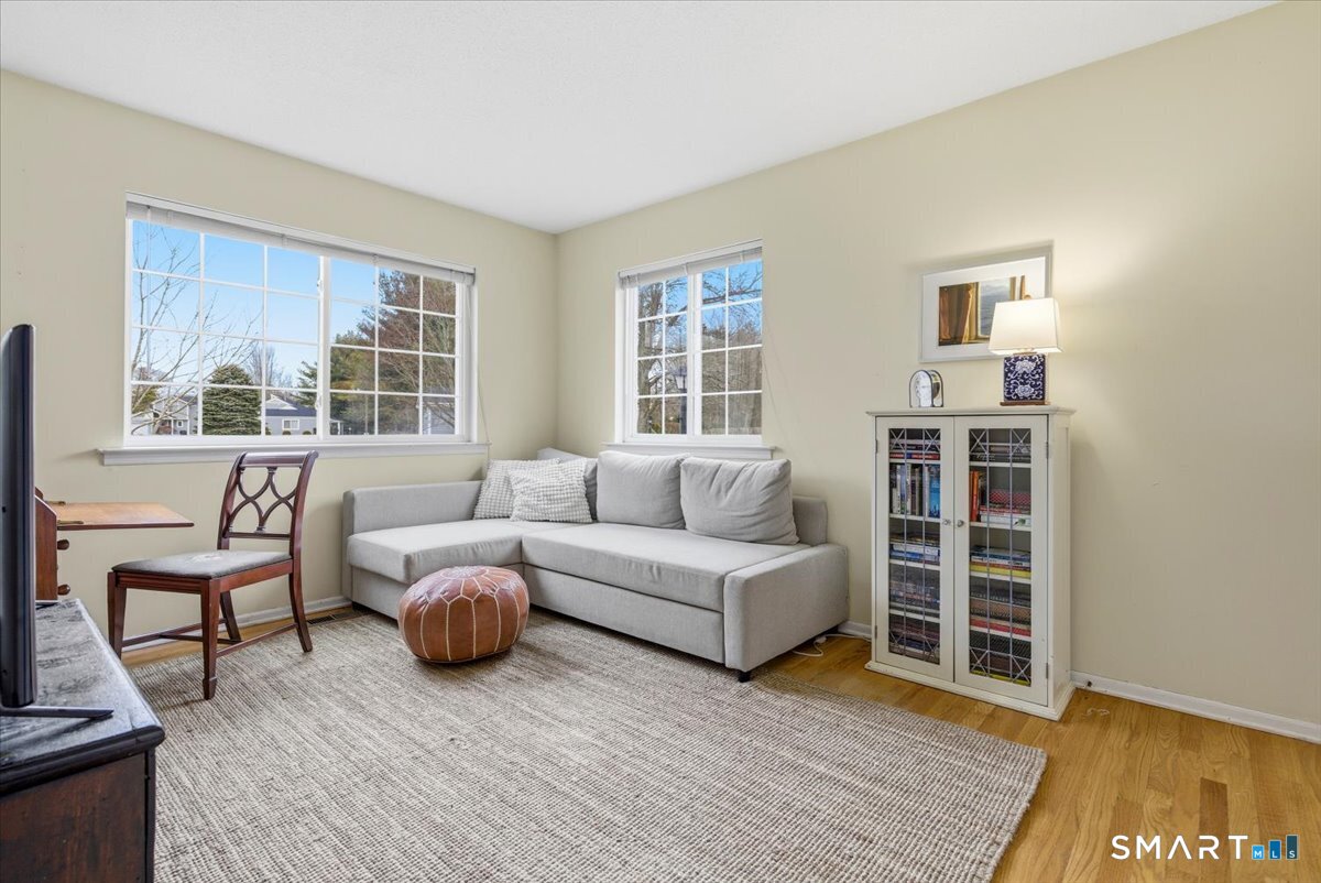 367 Main Street, Unit 7 Old Saybrook, CT 06475 - Photo 17 of 27 a living room with furniture and windows