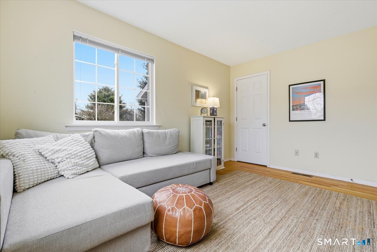 367 Main Street, Unit 7 Old Saybrook, CT 06475 - Photo 18 of 27 a living room with furniture and a large window