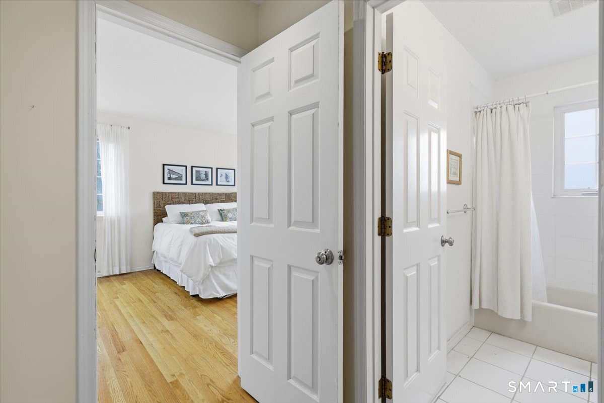 367 Main Street, Unit 7 Old Saybrook, CT 06475 - Photo 21 of 27 a bedroom with a bed and a cabinets