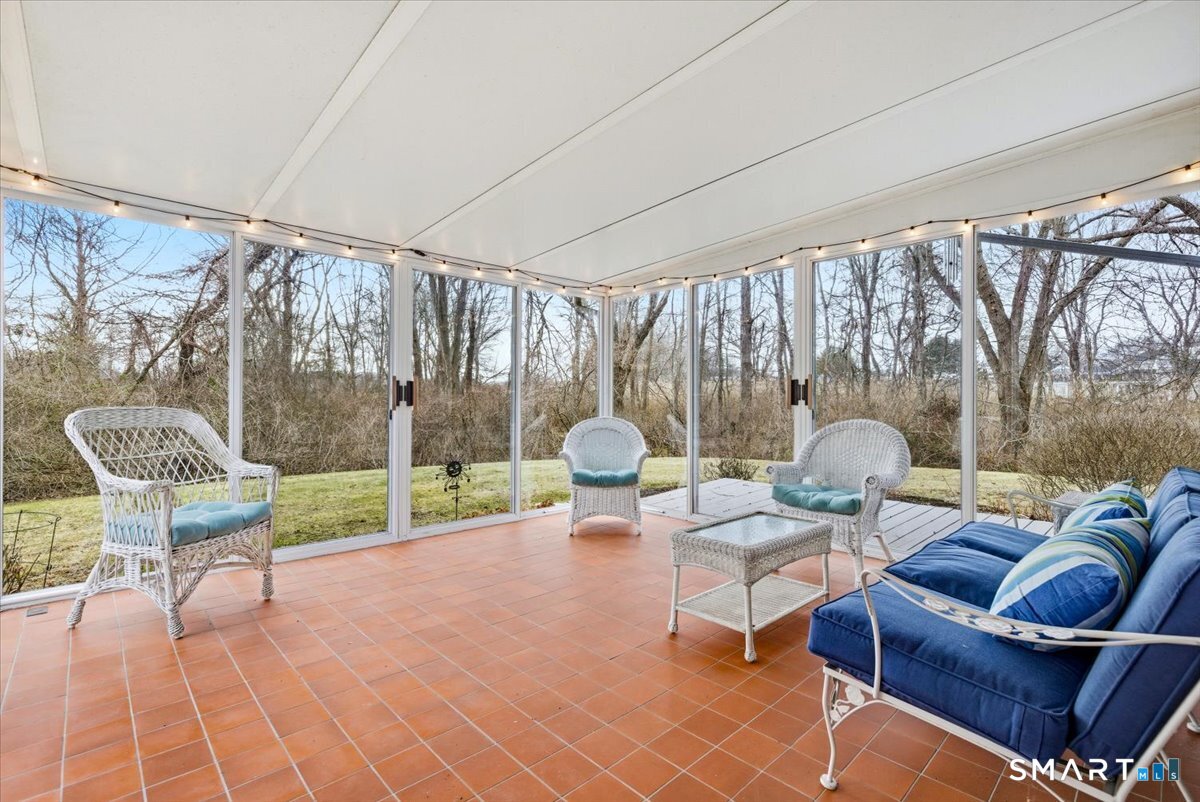 367 Main Street, Unit 7 Old Saybrook, CT 06475 - Photo 26 of 27 a living room with furniture and a floor to ceiling window