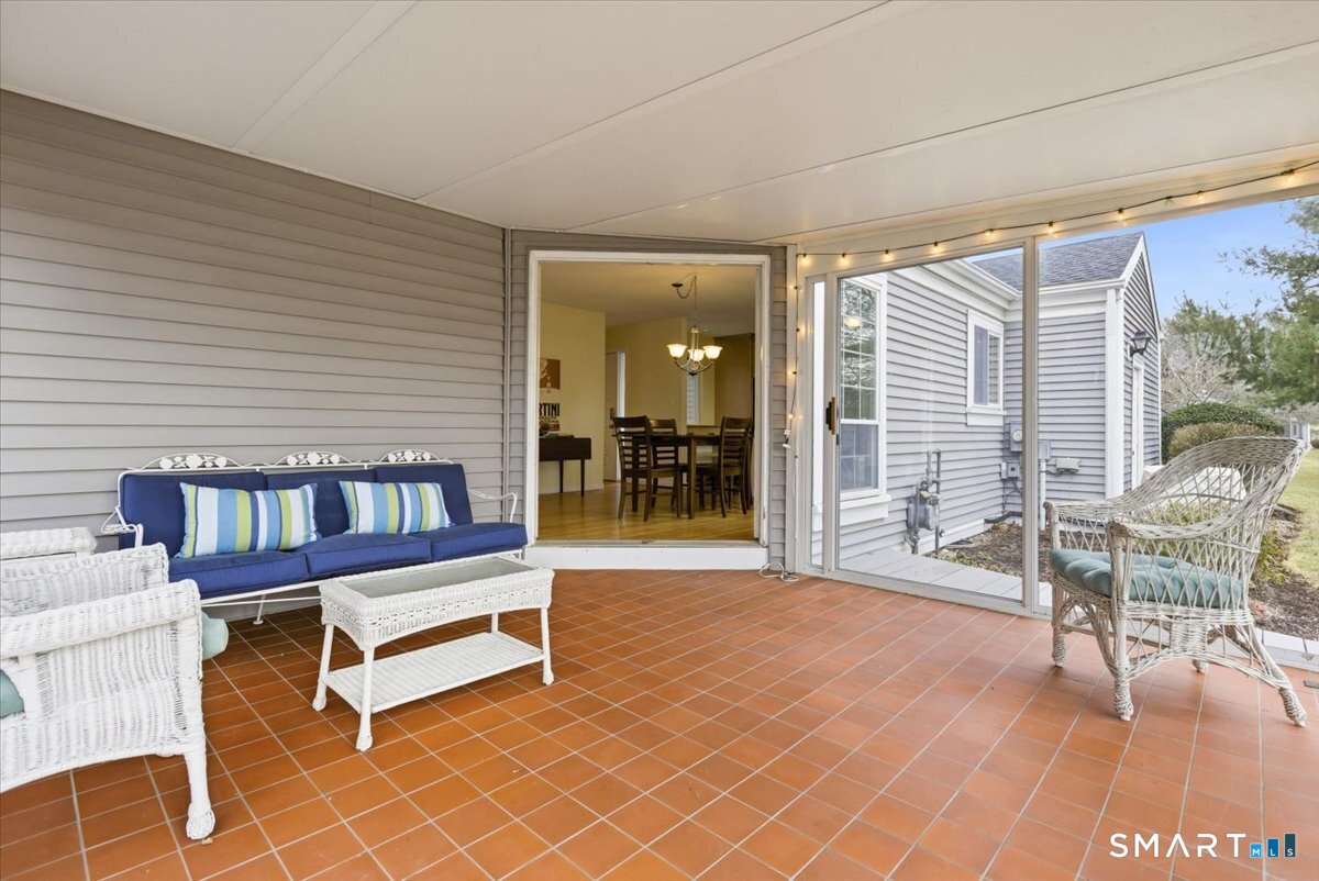 367 Main Street, Unit 7 Old Saybrook, CT 06475 - Photo 27 of 27 a living room with furniture a wooden floor and a large window