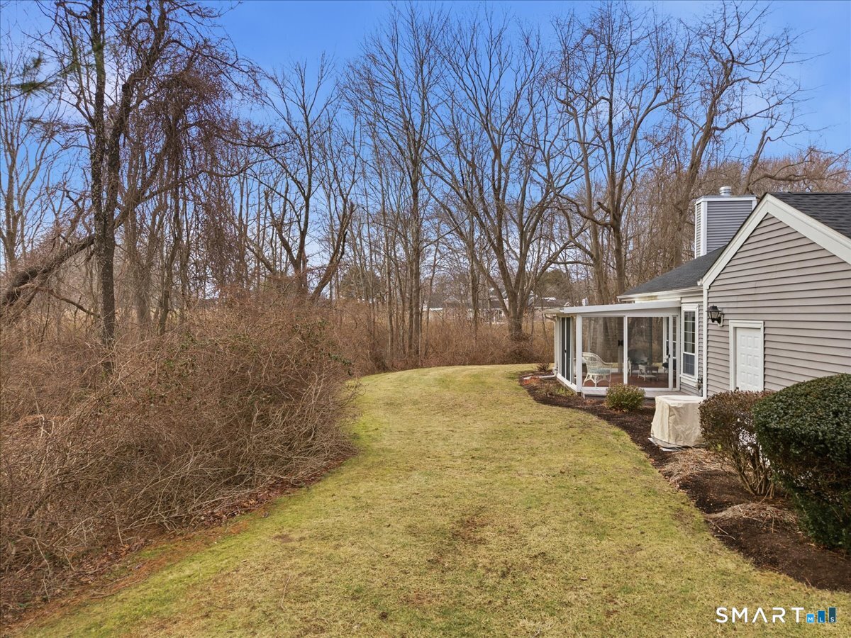 367 Main Street, Unit 7 Old Saybrook, CT 06475 - Photo 4 of 27 a view of a yard with wooden fence
