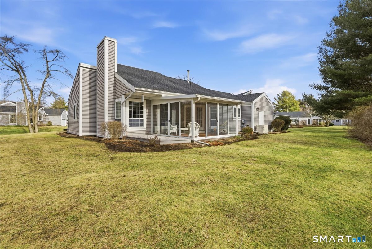 367 Main Street, Unit 7 Old Saybrook, CT 06475 - Photo 10 of 27 a front view of a house with a yard