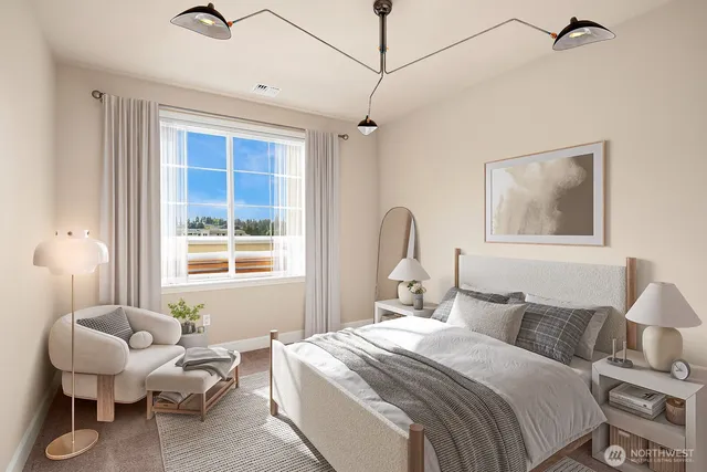 a bedroom with bed and a window