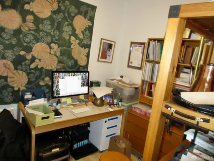 a view of workspace with wooden floor