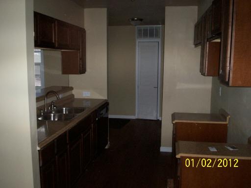 132 Kingston Road Bolingbrook, IL 60440 - Photo 3 of 9 a kitchen with a sink and a refrigerator