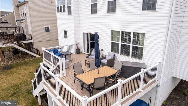 a balcony with table and chairs