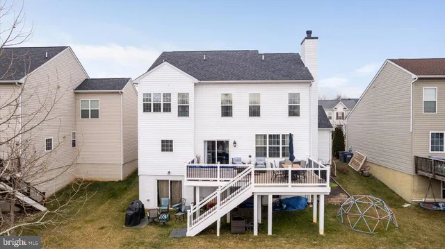 a aerial view of a house with a yard