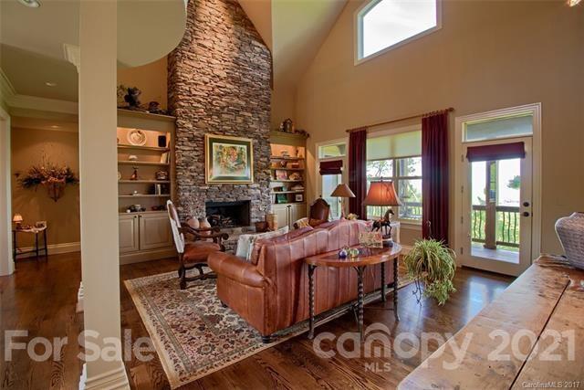 851 Sunlight Ridge Drive Hendersonville, NC 28792 - Photo 5 of 6 a living room with furniture windows and a fireplace