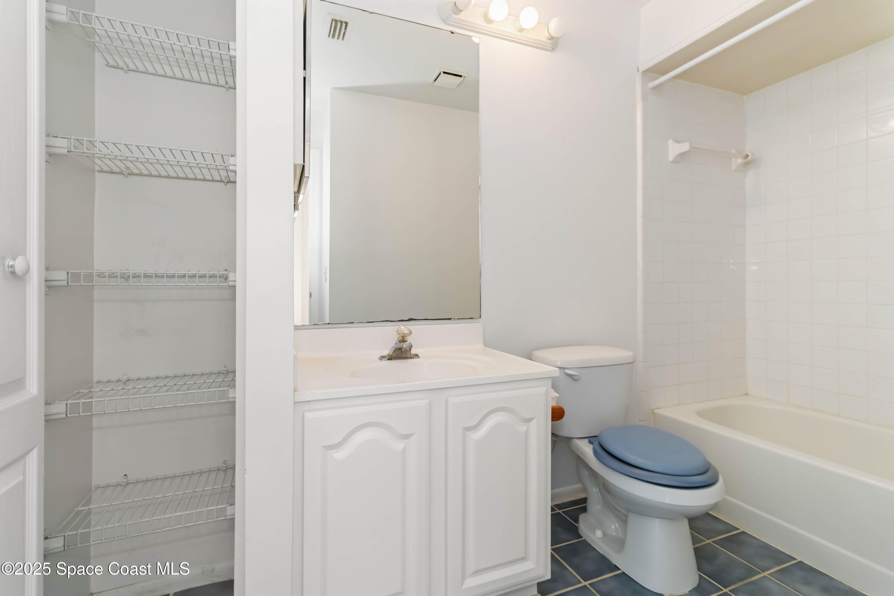 3728 West Malory Court Cocoa, FL 32926 - Photo 12 of 37 a bathroom with a sink a toilet and shower