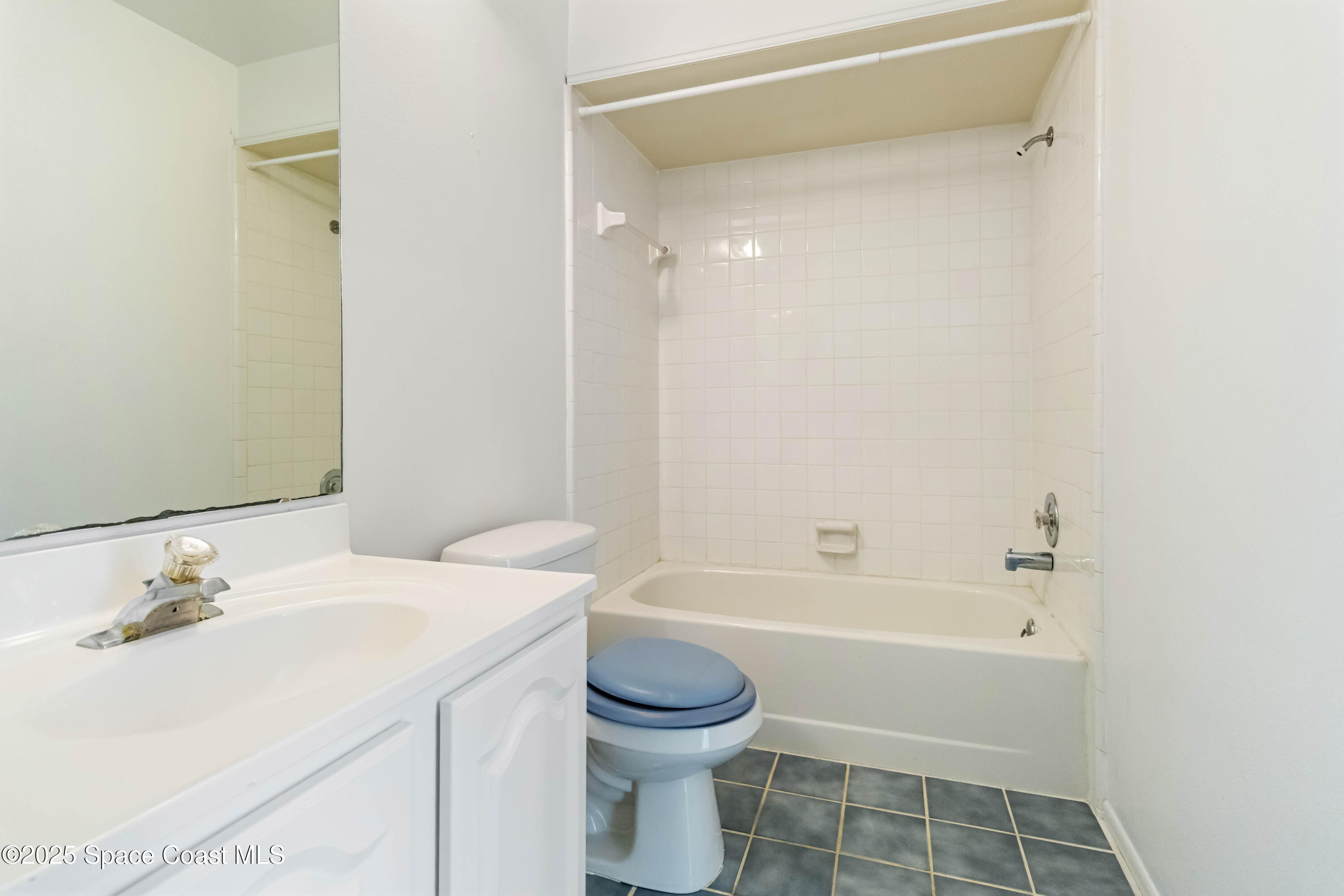 3728 West Malory Court Cocoa, FL 32926 - Photo 13 of 37 a bathroom with a sink a toilet and a bathtub