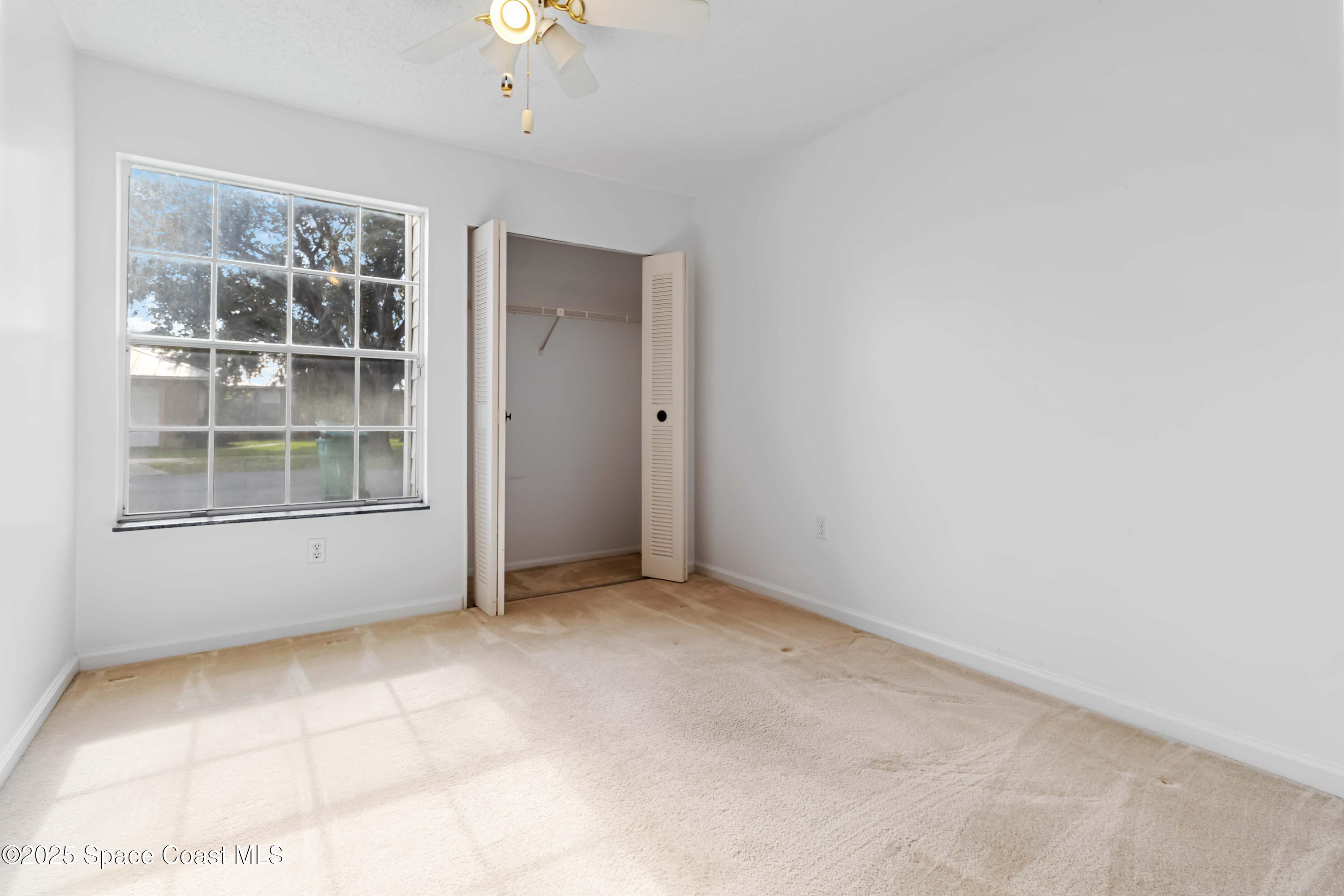 3728 West Malory Court Cocoa, FL 32926 - Photo 14 of 37 an empty room with windows