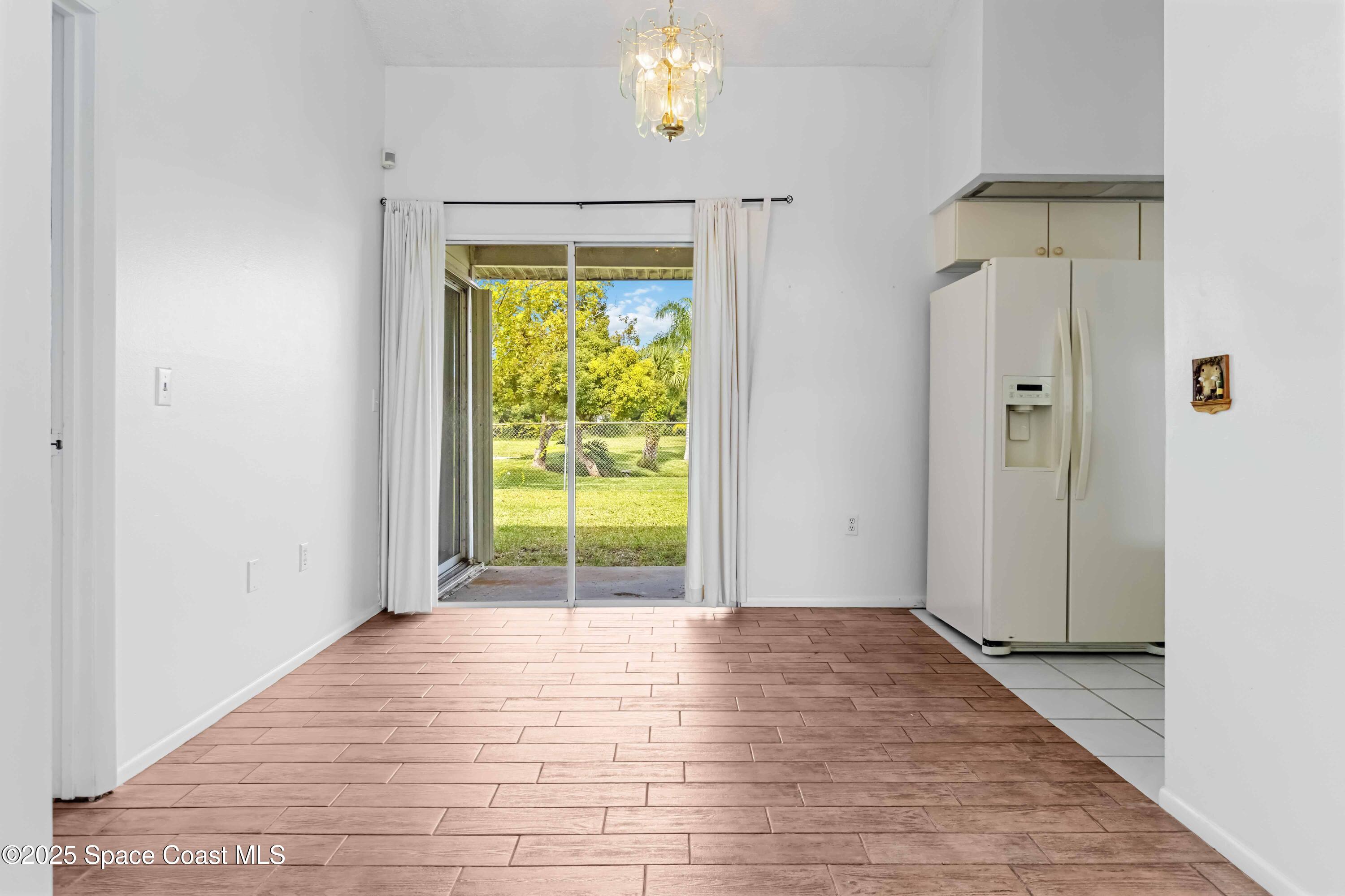 3728 West Malory Court Cocoa, FL 32926 - Photo 16 of 37 a view of an empty room with bathroom and a window
