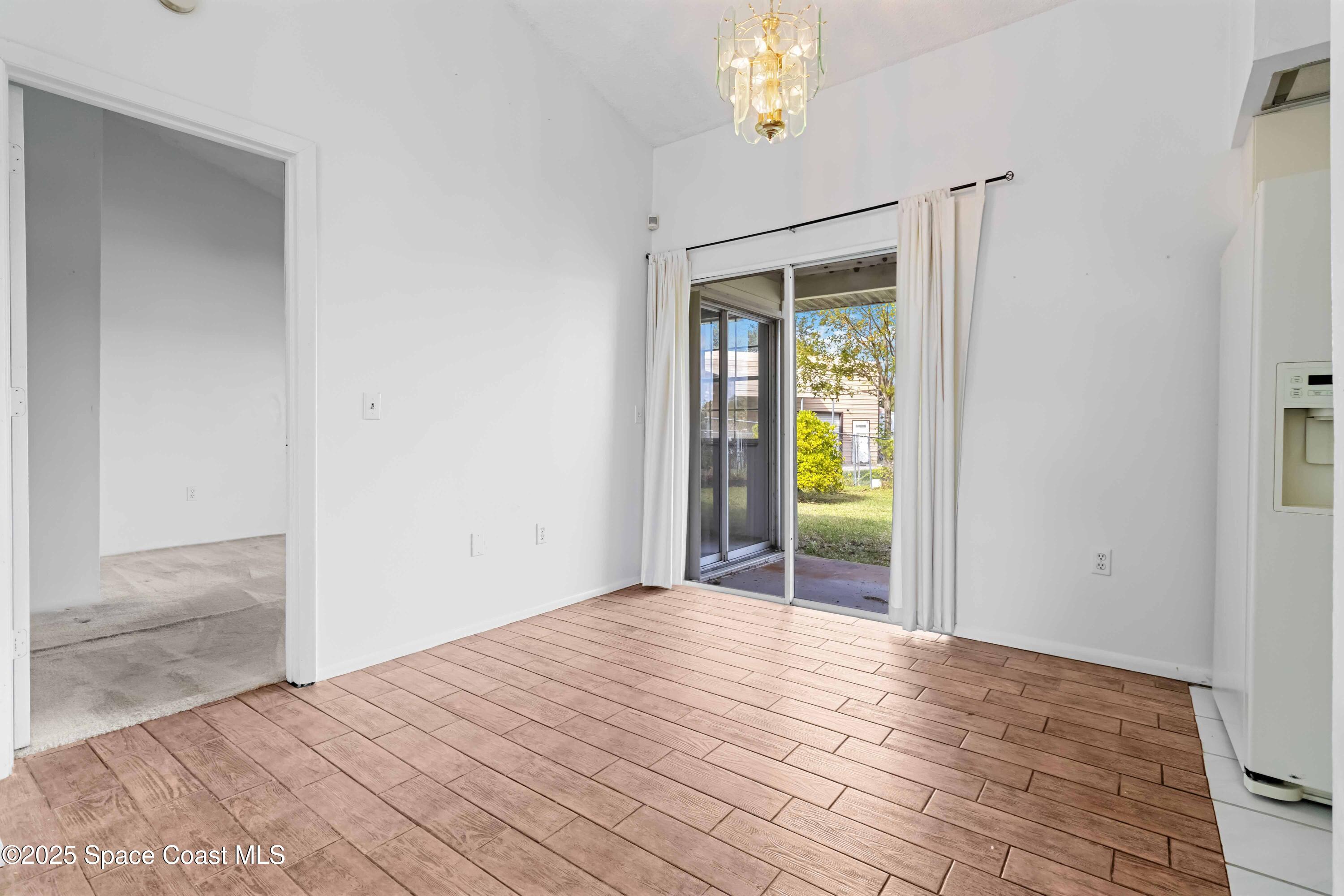 3728 West Malory Court Cocoa, FL 32926 - Photo 17 of 37 a view of a room that has a bed and a window