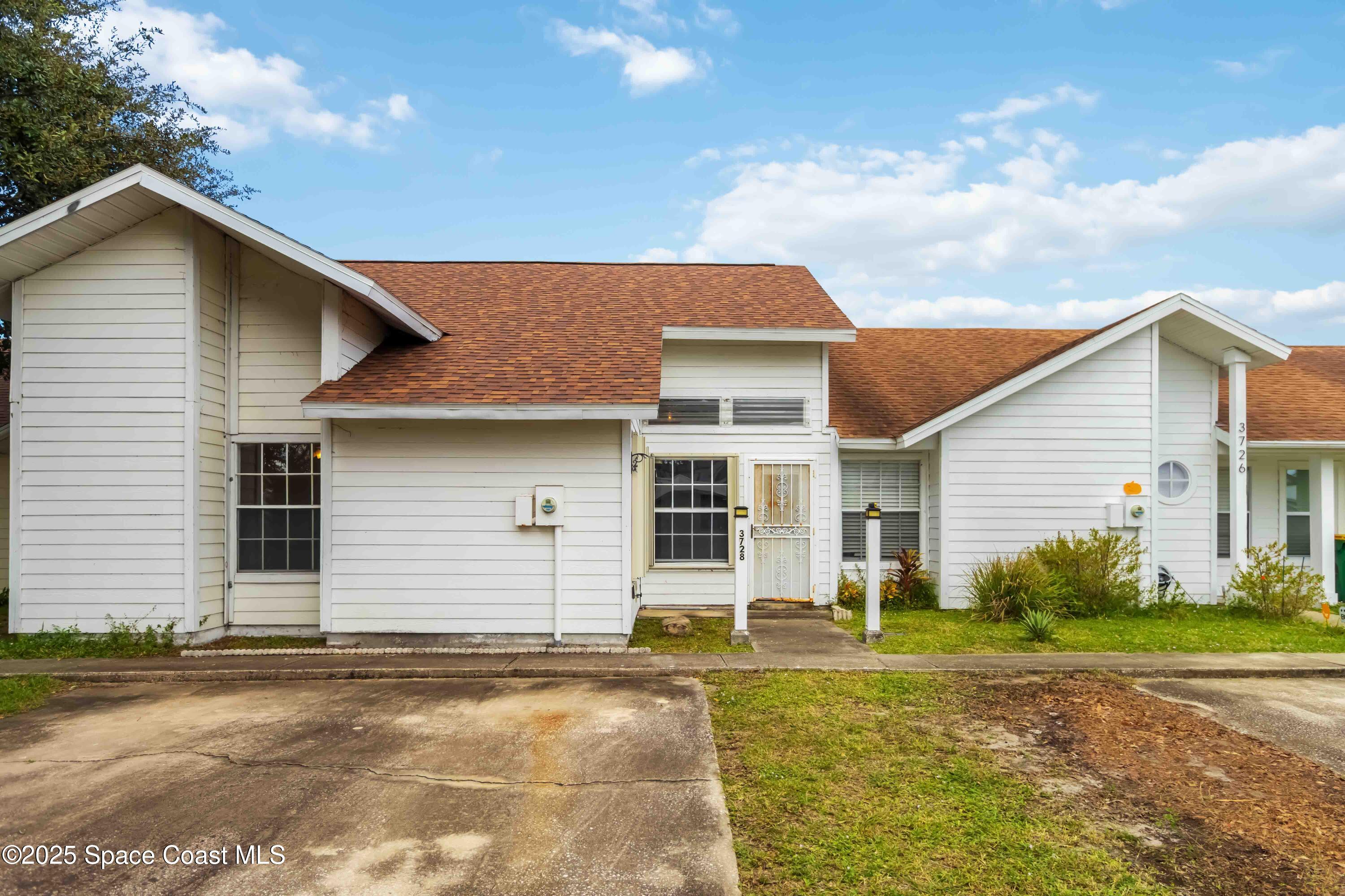 3728 West Malory Court Cocoa, FL 32926 - Photo 2 of 37 a view of a backyard of the house