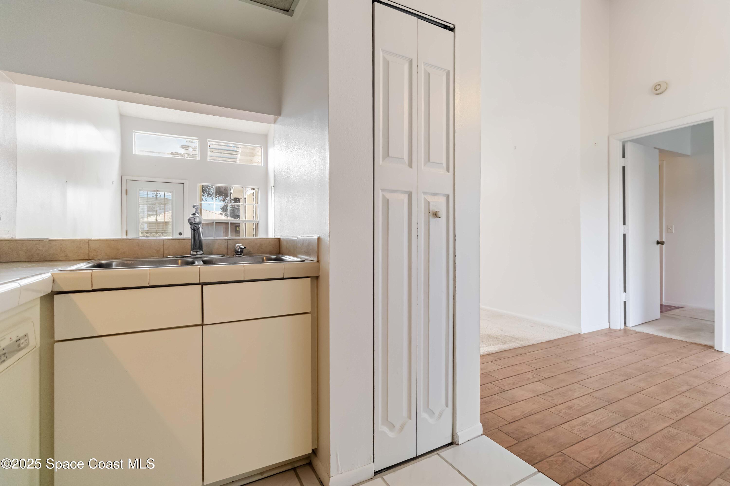 3728 West Malory Court Cocoa, FL 32926 - Photo 21 of 37 a bathroom with a sink and mirror